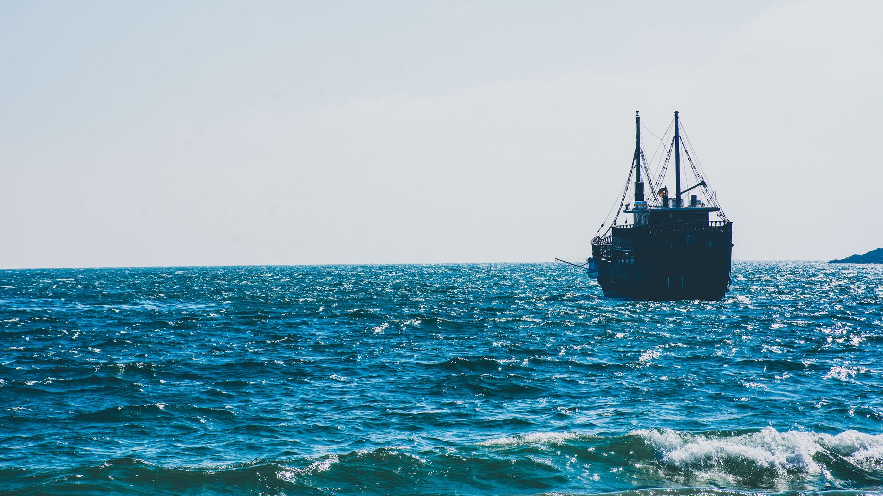 Schooner on a hazed sea