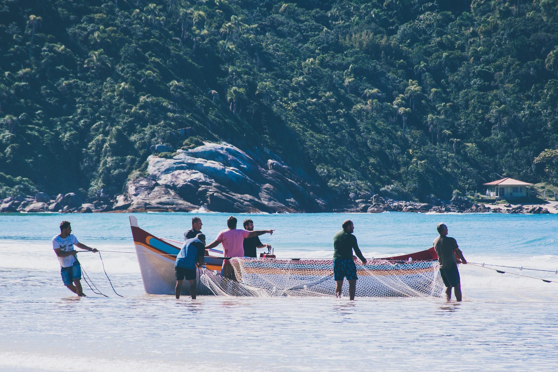Net trailing behind the boat as the seine is laid