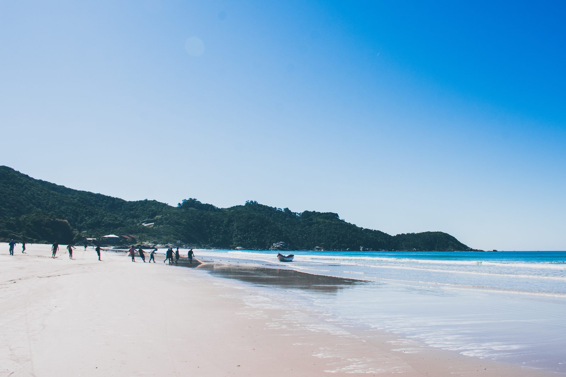 Crew walking the boat back to shore